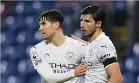  ?? ?? John Stones (left) and Rúben Dias have been rocks for Manchester City this season as Pep Guardiola’s side have adapted to a more restrained, structured game. Photograph: Gareth Copley/PA