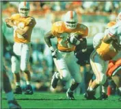  ?? TENNESSEE ATHLETICS PHOTO ?? Current Tennessee running backs coach Jay Graham carries the ball as a Vols junior running back in 1995.