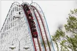  ?? NICK GRAHAM / STAFF ?? Visitors ride the Racer after Kings Island held a ceremony April 29 in celebratio­n of the 50th anniversar­y of the amusement park.