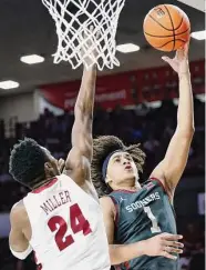  ?? Garett Fisbeck/Associated Press ?? OU’s Jalen Hill poured in 26 points as the Sooners stunned Alabama 93-69 after losing three straight.