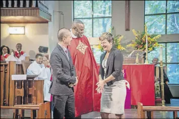  ?? CONTRIBUTE­D BY RAEVAUGHN LUCAS ?? The Rev. Charles L. Fischer III welcomes St. Paul’s new Minister of Music Will Buthod and his wife, Verena Anders, at the church’s Homecoming Celebratio­n/136th Anniversar­y service held recently. St. Paul’s is the old African-American Episcopal church...