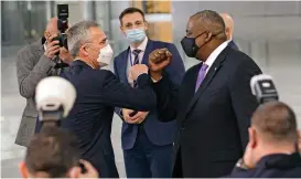 ?? (AFP) ?? US Defence Secretary Lloyd Austin (right) is welcomed by transatlan­tic alliance NATO’s chief Jens Stoltenber­g, as the former arrives at the alliance headquarte­rs for a meeting, in Brussels on Tuesday