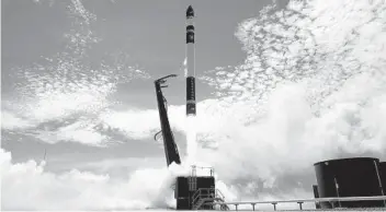  ?? ROCKET LAB ?? An electron rocket from Rocket Lab carrying only a small payload of about 331 pounds lifts off from the Mahia Peninsula in New Zealand in 2018.