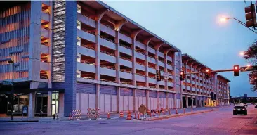  ?? [PHOTO BY DOUG HOKE, THE OKLAHOMAN] ?? Oklahoma City officials are considerin­g selling the Santa Fe Parking Garage in downtown Oklahoma City to BancFirst and Continenta­l Resources. The plan would allow the city to reduce the debt it will need to secure to build another parking garage near the planned convention center.