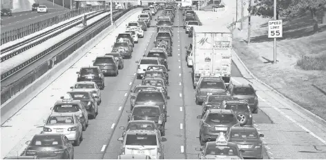  ?? 2015 PHOTO BY SCOTT OLSON, GETTY IMAGES ?? Some 35 million Americans will hit the road this weekend hoping to avoid traffic like this on Chicago’s Kennedy Expressway.