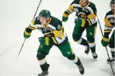  ?? PHOTOS: BRANDON HARDER ?? The Humboldt Broncos’ Michael Clarke skates toward the bench after scoring a goal during a hard-fought SJHL playoff series against the Estevan Bruins, won by Estevan in overtime of Game 7.