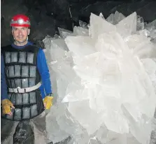  ??  ?? To battle the extreme heat in the caves where the microbes were found, researcher­s strapped on ice packs.