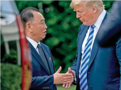  ?? Associated Press ?? President Donald Trump greets Kim Yong Chol, former North Korean military intelligen­ce chief and one of leader Kim Jong Un’s closest aides, after their meeting in the Oval Office of the White House in Washington on Friday.