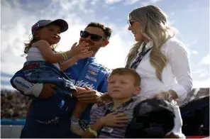  ?? (Jared C. Tilton/Getty Images) ?? Kyle Larson with his his wife Katelyn, son Owen and daughter Audrey prior to his Cup Series Championsh­ip at Phoenix Nov. 7.