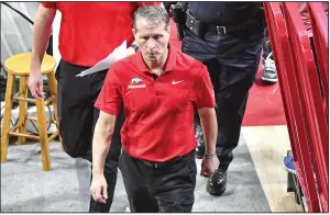  ?? (NWA Democrat-Gazette/Hank Layton) ?? Coach Eric Musselman (above) walks off the court following Arkansas’ 92-63 loss to Tennessee on Feb. 14 at Walton Arena in Fayettevil­le. The Razorbacks, who were ranked No. 14 in the Associated Press and USA Today preseason coaches’ polls, finished 16-17 this season, which ended with a 80-66 loss to South Carolina on Thursday in the second round of the SEC Tournament in Nashville, Tenn.