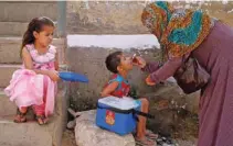  ?? - Reuters/Akhtar Soomro ?? ERADICATE DEADLY VIRUS: A boy receives polio vaccine drops, during an anti-polio campaign, in a low-income neighbourh­ood in Karachi, Pakistan April 9, 2018.