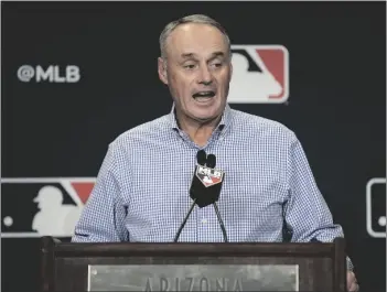  ?? AP PHOTO/MORRY GASH ?? Major League Baseball Commission­er Robert Dean Manfred Jr. answers questions at spring training media day on Wednesday in Phoenix.