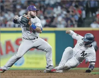  ?? John Minchillo Associated Press ?? MAX MUNCY turns a double play at second with Gleyber Torres of the Yankees sliding into the base during the eighth inning of the All-Star game. Muncy went 0 for 2 at the plate.