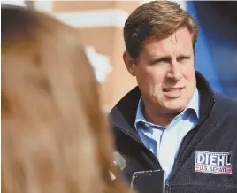  ?? HERALD PHOTO BY JEFF PORTER ?? MEET AND GREET: U.S. congressio­nal candidate Geoff Diehl stops by the Weymouth Great Pumpkin Festival at Weymouth High School.