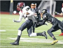  ?? [PHOTO BY JOEY JOHNSON, FOR THE TULSA WORLD] ?? Tulsa Washington’s Javion Markham brings down Del City’s Jack Foreman during the first round of the 6A-II playoffs Friday at Tulsa. Tulsa Washington won, 27-8.