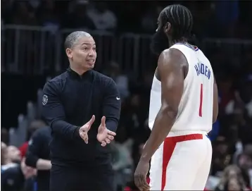  ?? JOHN BAZEMORE — THE ASSOCIATED PRESS ?? Clippers head coach Tyronn Lue talks on the sideline with James Harden during a game last week in Atlanta.