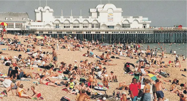  ?? ?? Sunseekers on a packed Southsea beach in 1999.