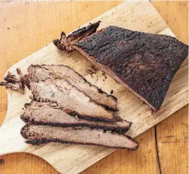  ?? [PHOTO DANIEL J. VAN ACKERE, AMERICA’S TEST KITCHEN/AP] ?? Barbecued beef brisket appears in the cookbook “Master of the Grill.”