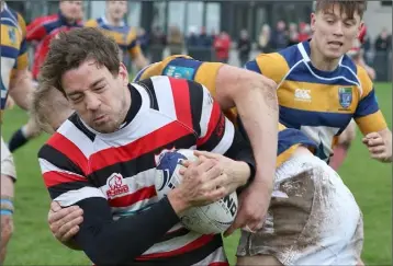  ??  ?? Enniscorth­y’s Richard Dunne is tackled by Dan Costello of Monkstown.