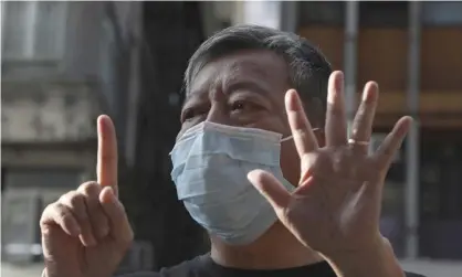  ??  ?? Hong Kong pro-democracy activist Lee Cheuk-Yan gives the ‘five demands, not one less’ hand sign. Zoom has admitted it disrupted activists’ meetings at the behest of the Chinese government. Photograph: Kin Cheung/AP