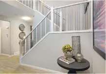  ??  ?? The welcoming front foyer in the Henderson show home, which features a number of head-turning elements.