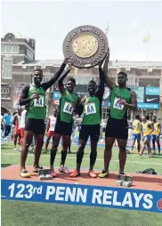  ??  ?? Members of the Calabar High sprint relay team (from left: Michael Stephens, Christophe­r Taylor, Tyreke Wilson and DeJour Russell) after winning the Championsh­ip of America 4x100 metres relay in a record 39.00 seconds at the Penn Relays last year.