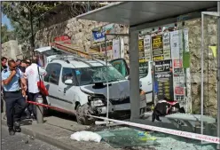  ??  ?? Carnage: the scene of the meat cleaver attack in Jerusalem