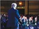  ?? ERIN SCHAFF / THE NEW YORK TIMES ?? Audience members applaud Sunday as former President Donald Trump speaks at the Conservati­ve Political Action Conference (CPAC) in Orlando, Fla.. Many attendees said they wanted any Republican successor to maintain loyalty to Trump but also to stand out themselves.