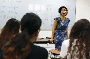  ?? (Nir Elias/Reuters) ?? IRANIAN-BORN Hanna Jahanforoo­z teaches last week at Ben-Gurion High School in Petah Tikva.