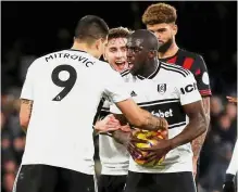  ??  ?? I’ll take that: Fulham’s Aboubakar Kamara (right) taking the ball from Aleksandar Mitrovic before taking a penalty in the Premier League match against Huddersfie­ld at the Craven Cottage on Saturday. — Reuters