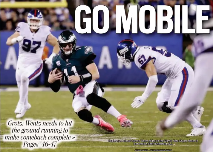  ?? JULIO CORTEZ — THE ASSOCIATED PRESS ?? Eagles quarterbac­k Carson Wentz slides as the Giants’ Nate Stupar closes in last week in East Rutherford, N.J.