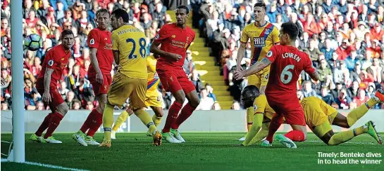  ??  ?? Timely: Benteke dives in to head the winner