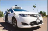  ??  ?? A Waymo minivan arrives to pick up passengers for an autonomous vehicle ride on April 7, 2021, in Mesa, Arizona. (AP)