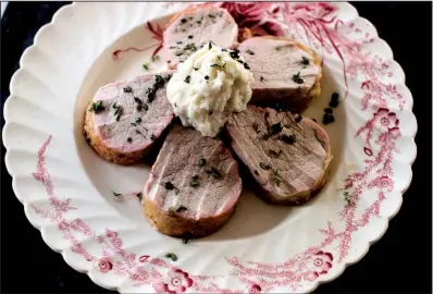  ?? AP/MATTHEW MEAD ?? Holiday Roasted Pork Tenderloin with Garlic Potato Puree