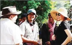  ?? COURTESY OF PAX JOLIE PITT ?? Co-producer Rithy Panh (left), translator Phichith Rithea and Angelina Jolie Pitt.