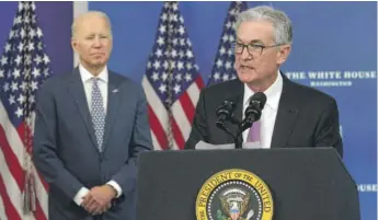  ?? ALEX WONG/GETTY IMAGES ?? Federal Reserve Chair Jerome Powell speaks Monday as President Joe Biden looks on.