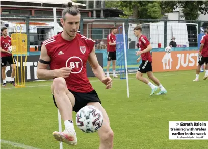  ?? Andrew Medichini/AP ?? > Gareth Bale in training with Wales earlier in the week