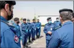  ?? KUNA photos ?? Top and above: Director General of Kuwait Fire Service Directorat­e (KFSD) Lieutenant General Khaled AlMekrad inspected on Sunday firemen tasked with securing a quarantine center in district of Al-Ardhiya and
another in Al-Zour.