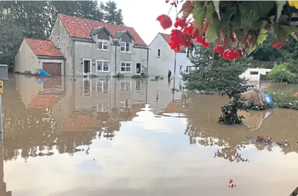  ??  ?? DAMAGE: Freuchie Mill is often hit by flooding, and there is a long-running campaign calling for the installati­on of flood defences.