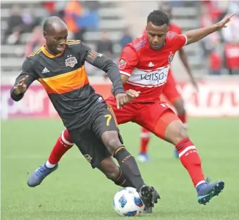  ?? JONATHAN DANIEL/GETTY IMAGES ?? DaMarcus Beasley (left) will face the Fire for the last time Saturday in Houston.