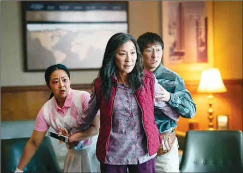  ?? ?? This image released by A24 Films shows, (from left), Stephanie Hsu, Michelle Yeoh and Ke Huy Quan in a scene from, ‘Everything Everywhere All At Once.’ (AP)