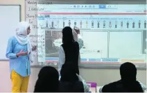  ?? Delores Johnson / ?? Al Ittihad National Private School uses interactiv­e projector images as teaching tools.