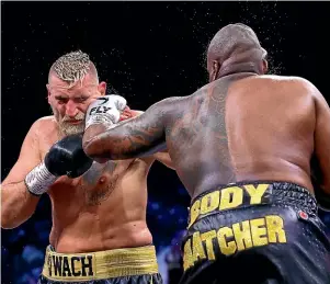  ?? GETTY IMAGES ?? Dillian Whyte lands a left hand on Mariusz Wach.