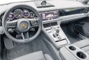  ?? POSTMEDIA ?? The Porsche Panamera Hybrid’s interior is a dandy place in which to spend time.