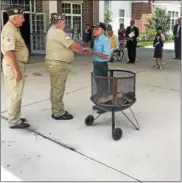  ?? COURTESY OF DEJOHN FUNERAL HOMES ?? Retired Vietnam veteran accepts flag from BurtonMidd­lefield American Legion VFW #459 members to cremate in honor of Flag Day.