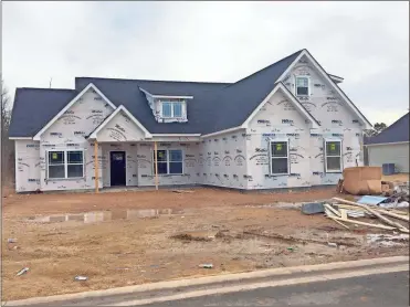  ?? Doug Walker ?? One of several homes, priced from the low 200s, currently under constructi­on in the Emerald Oaks subdivisio­n off Old Dalton Road.