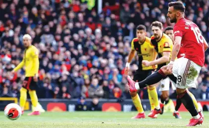  ??  ?? Bruno Fernandes opens the scoring for Man United against Watford from the penalty spot. It was his first goal for Unitged since joining them last month.Photo: AP