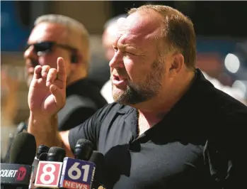  ?? JOE BUGLEWICZ/GETTY ?? Infowars founder Alex Jones speaks outside a courthouse on Sept. 21 in Waterbury, Connecticu­t.