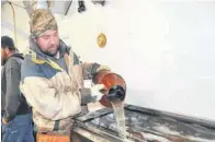  ?? ANDREW WAGSTAFF THE CITIZEN-RECORD ?? Frankie Mitchell pours the latest batch of maple syrup at Dickinson Bros. Maple Products in West Brook.
•