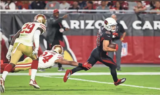  ??  ?? Cardinals rookie receiver Andy Isabella runs for a touchdown against the 49ers in the second half in Glendale on Thursday night. ROB SCHUMACHER/THE REPUBLIC